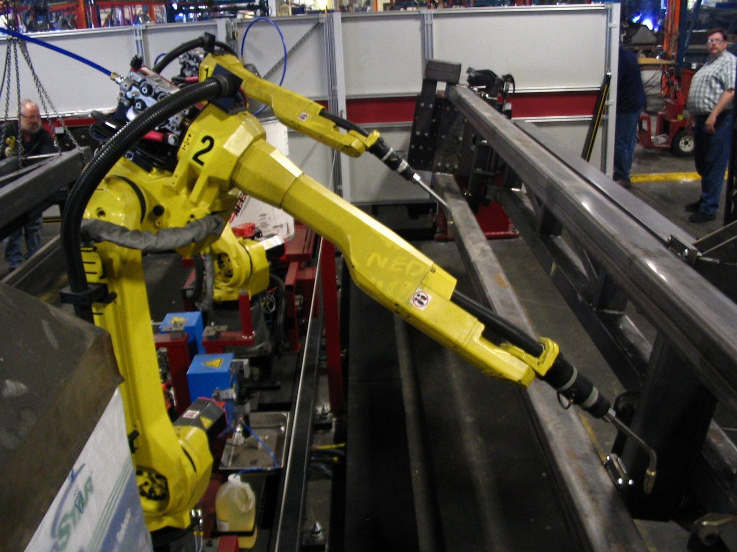 Factory robots: capital-intensive production uses more machines relative to labour