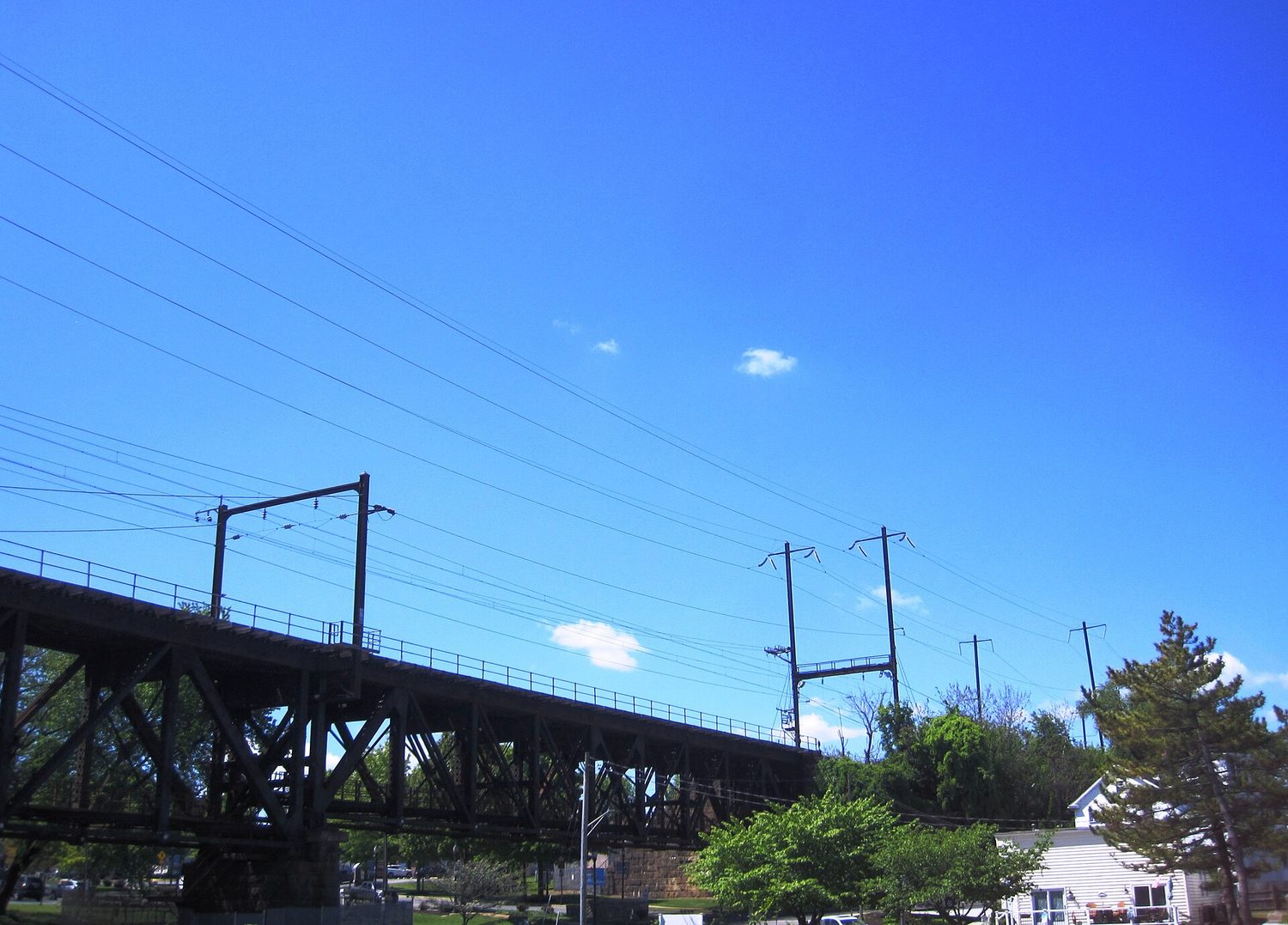 Overhead cables hanging in a curve between supports