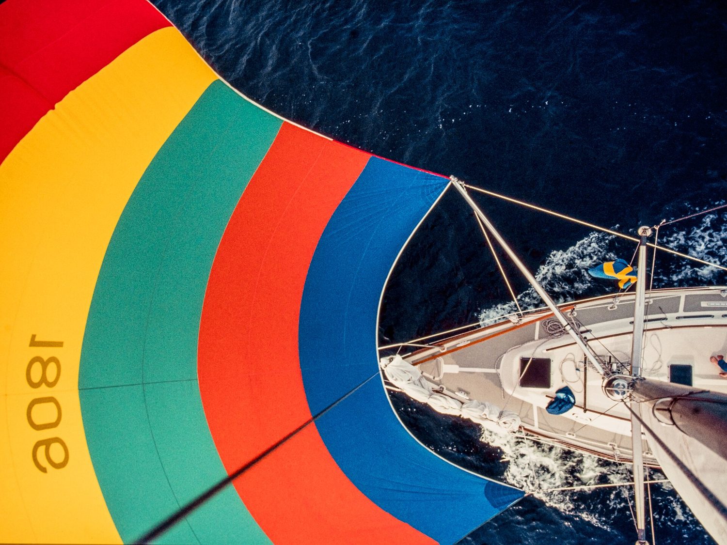 A sailing boat with a full spinnaker