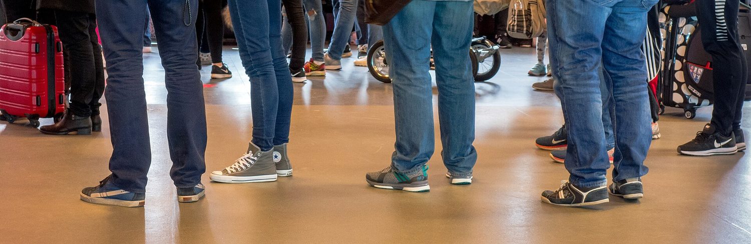 People waiting in a queue at a terminal