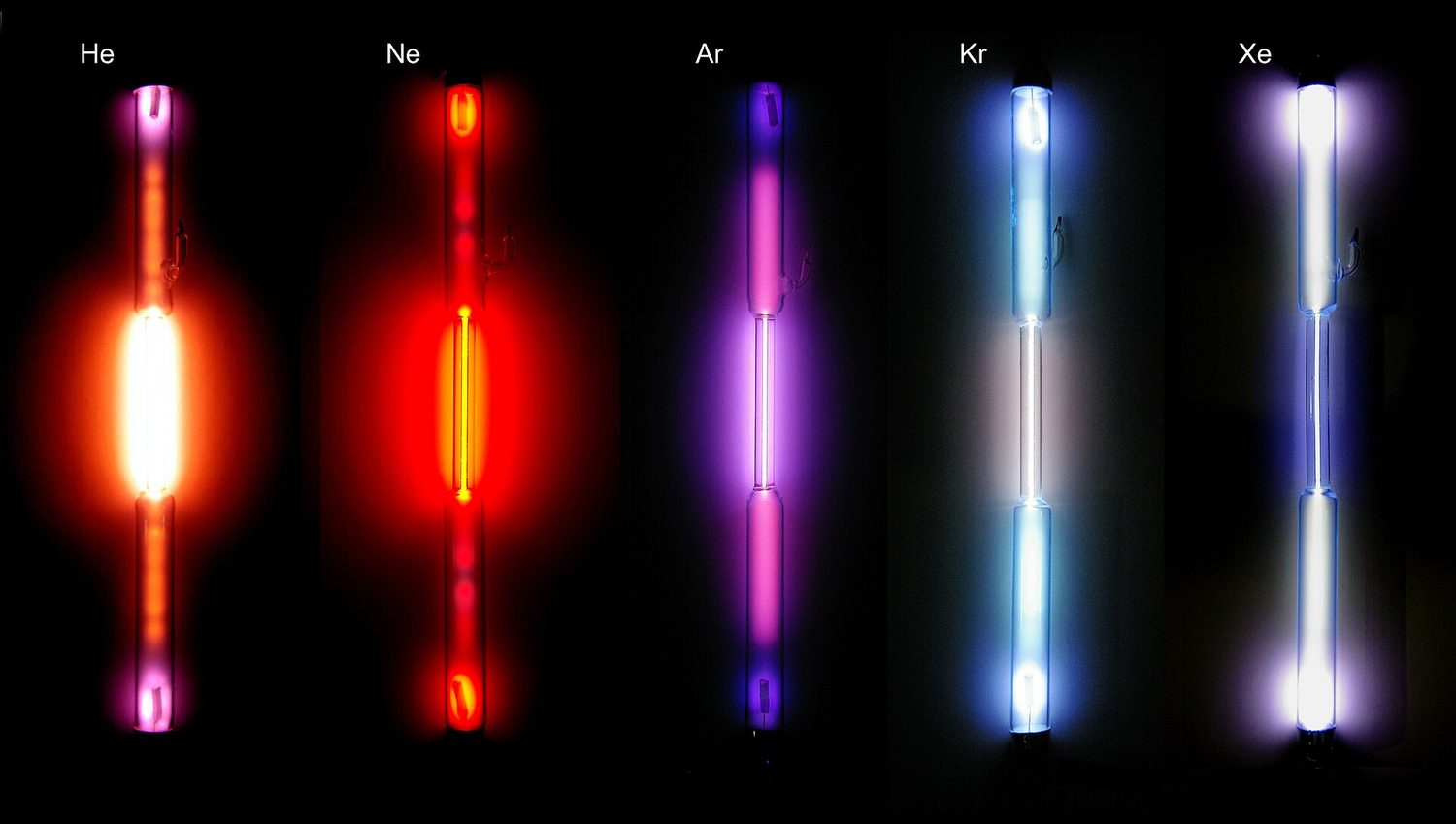 Five discharge tubes labelled He, Ne, Ar, Kr and Xe, each glowing a different colour