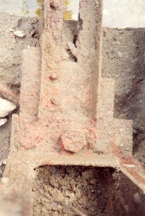 A heavily corroded metal post