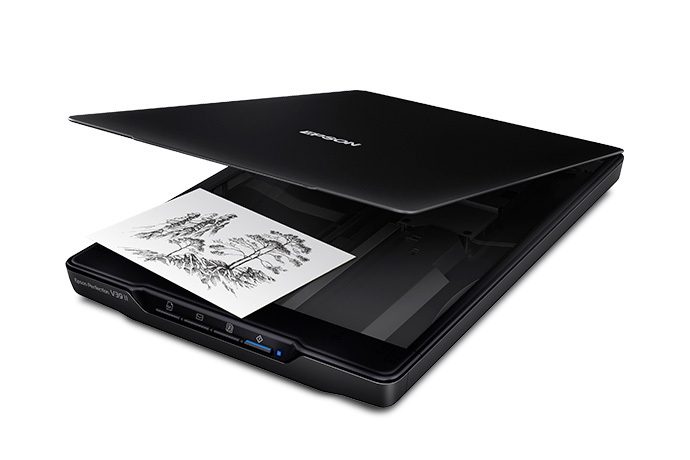 A flatbed scanner: it shines light across a page to copy it into the computer