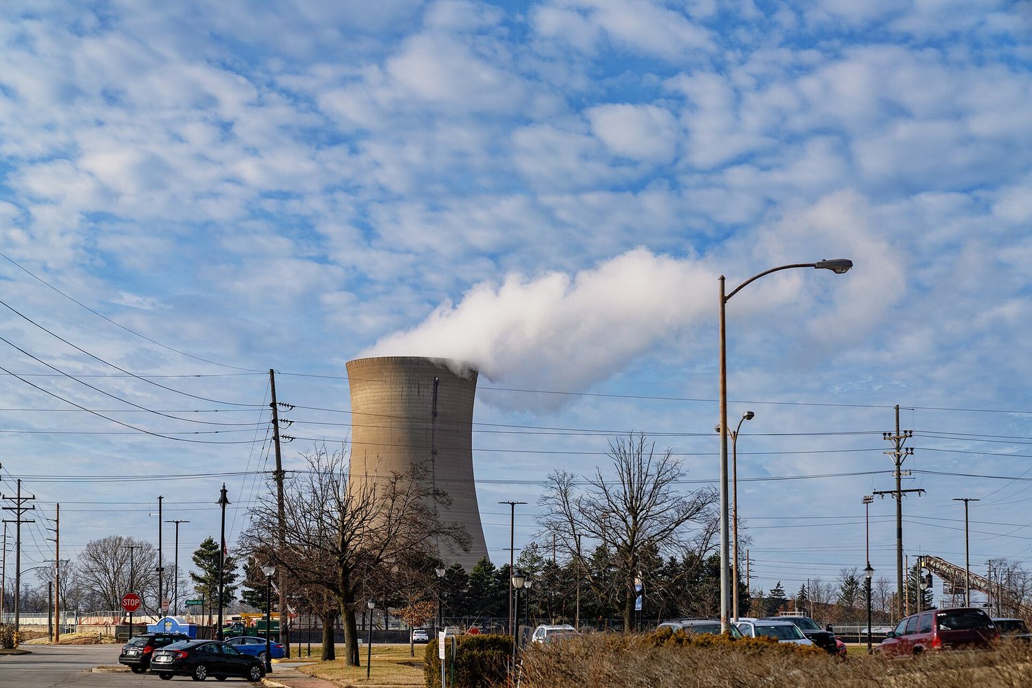 A coal power station cooling tower releasing a large plume