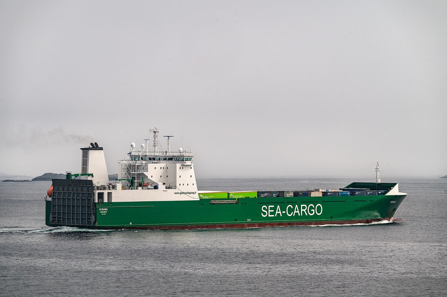 A large container ship carrying cargo at sea