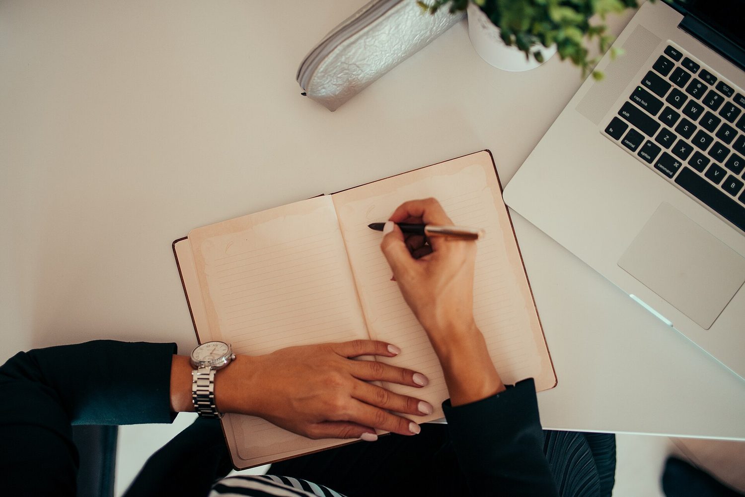 Writing on a laptop: informal emails still need a clear purpose, order and friendly tone